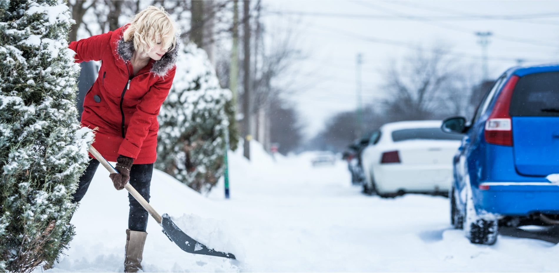 Woman shoveling snow not experiencing any OA pain