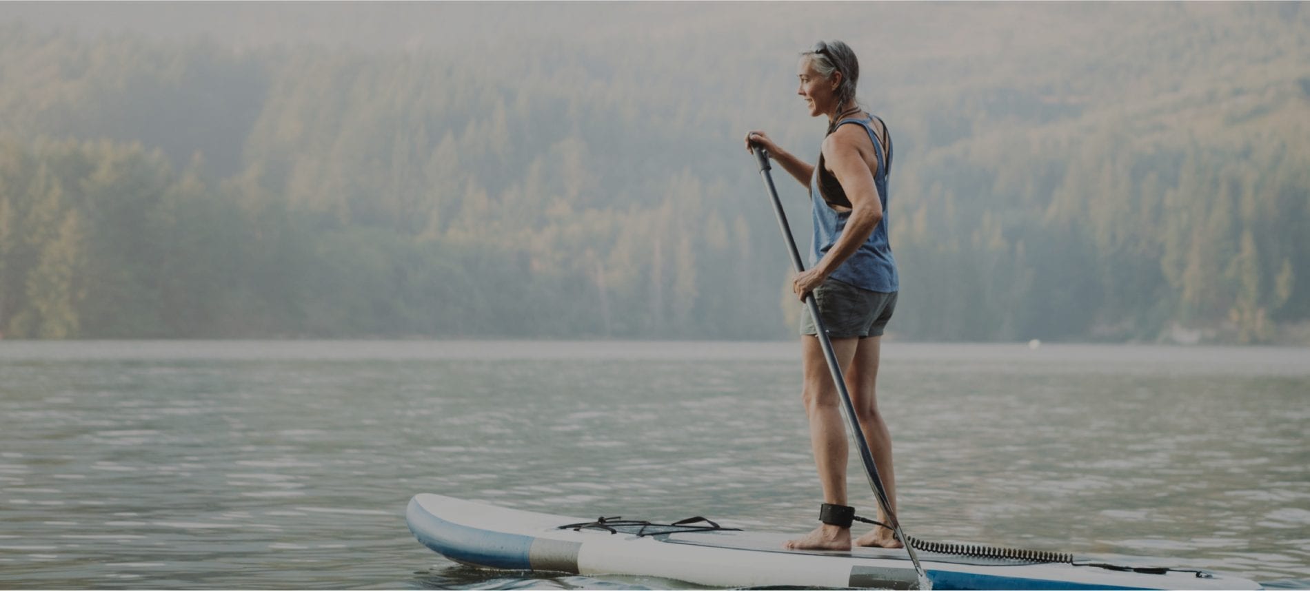 Woman paddle boarding
