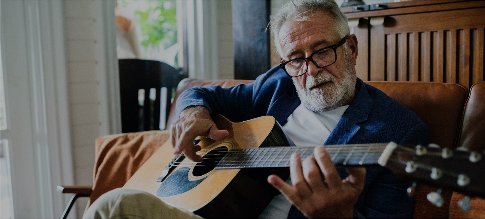 Man playing guitar without joint pain